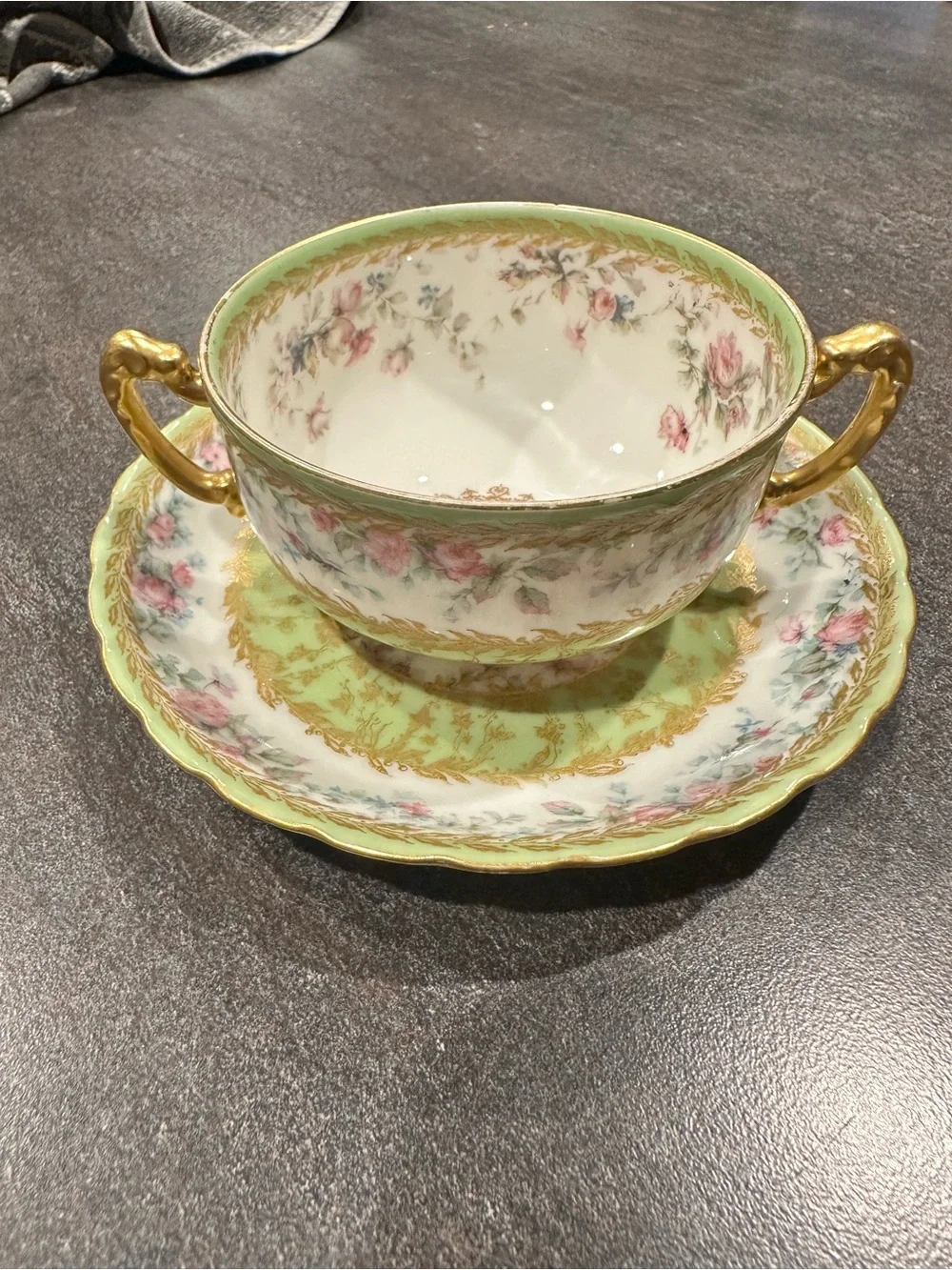 Haviland Porcelain Two-Handled Soup Cup and Saucer in Green, Pink and Gold